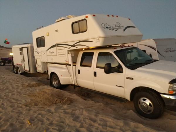 Truck and Camper Settling from Wind Blowing Sand Out from Tires